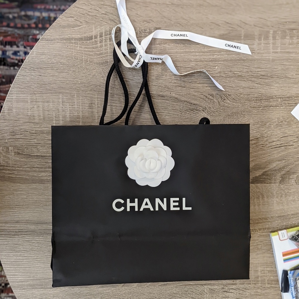 Chanel paper bag, ribbon and camellia flower
